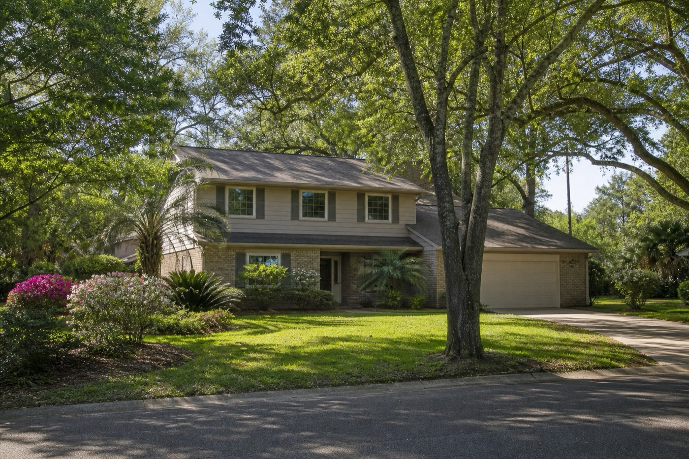 A two-story home on a shaded Longwood street