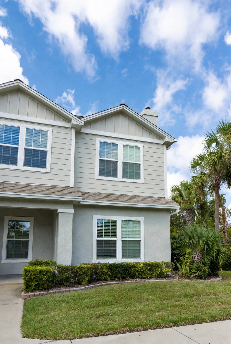 Exterior of modern suburban home with white vinyl double hung replacement windows, Lake Mary, FL
