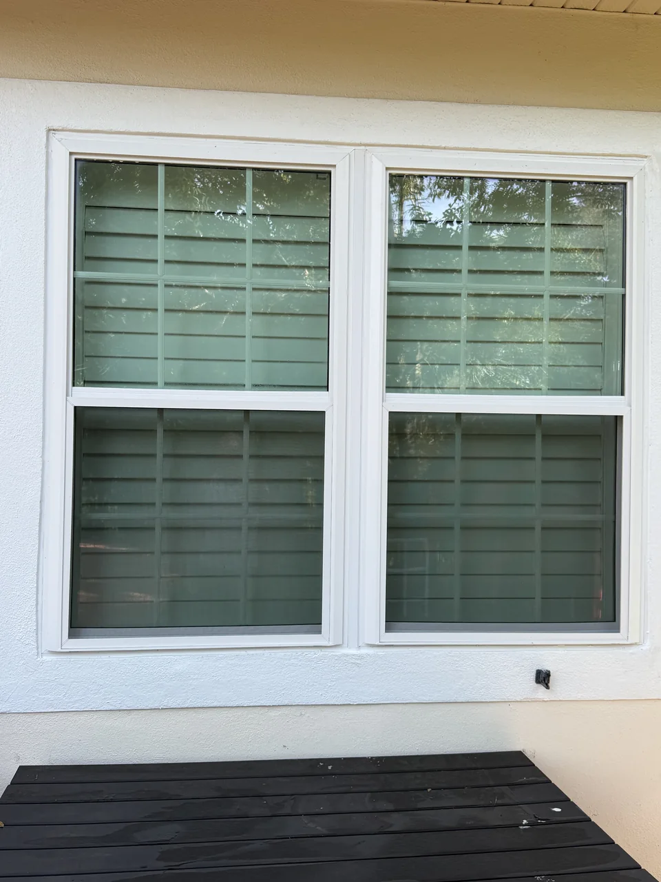 White replacement windows installed by Tom and his team at a customer's home